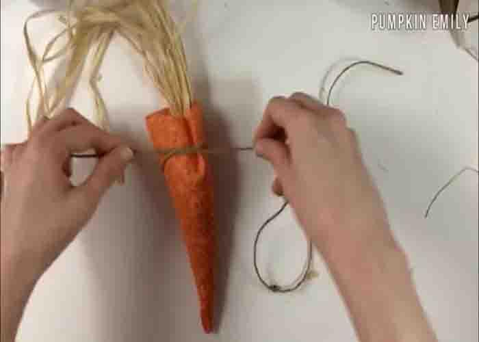 Tying the top of the no-sew fabric carrot