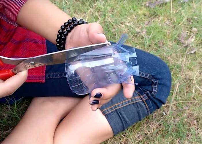 DIY snake trap built from a plastic bottle and an old fan guard, a humane way to catch snakes in the yard