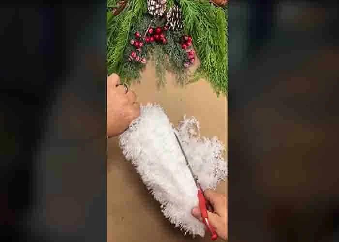 Shaping the Dollar Tree duster into a Christmas tree