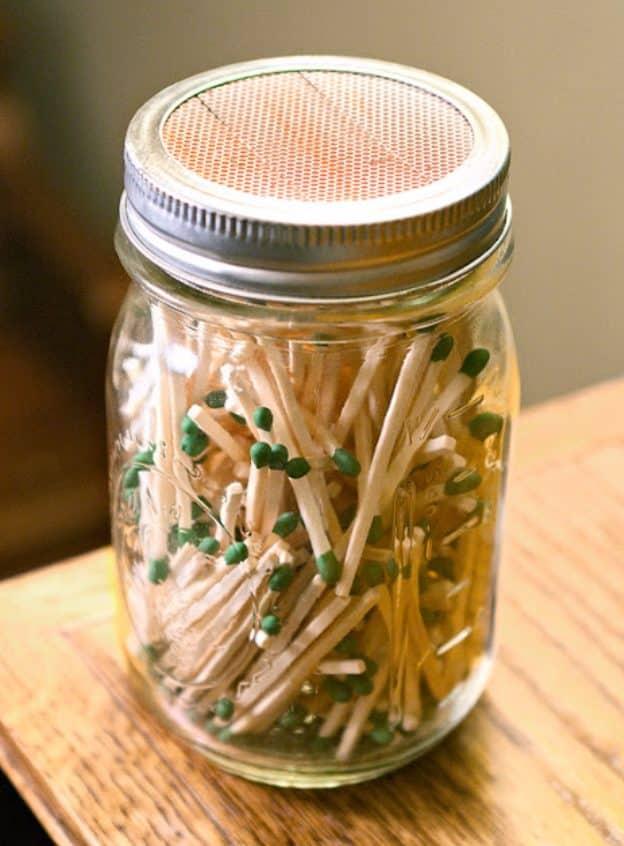 Mason jar match holder, wooden matches under a jar lid fitted with a striking pad cut from the matchbox
