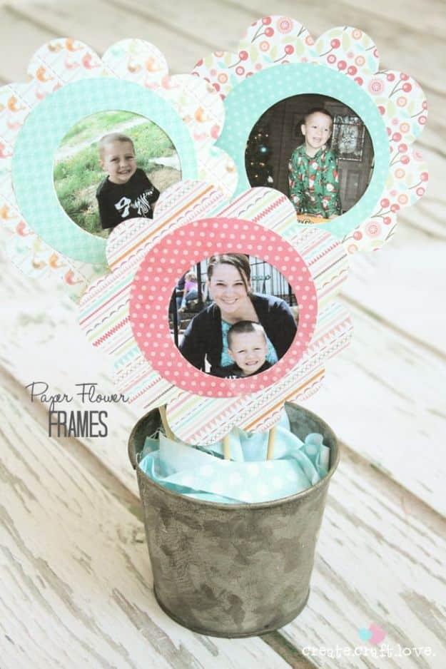 Three paper flower photo frames on skewers in a small galvanized pail, under a typeset Paper Flower Frames title