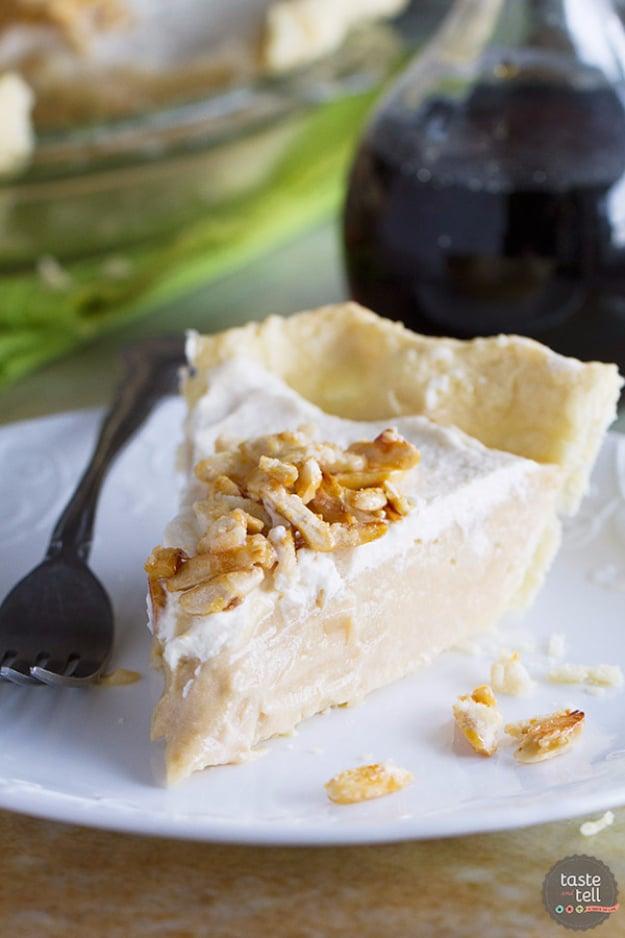 Maple cream pie topped with whipped cream and sugared almonds over a smooth maple custard pie filling