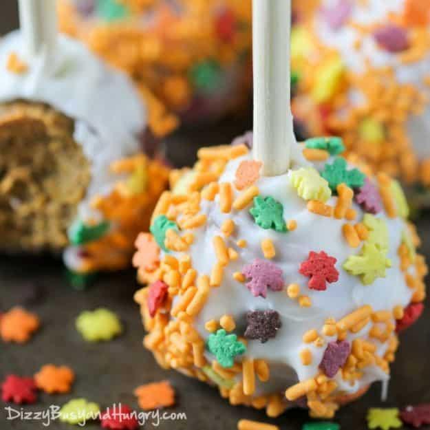Pumpkin spice cake pops made with spice cake mix and cream cheese frosting, dipped in white chocolate