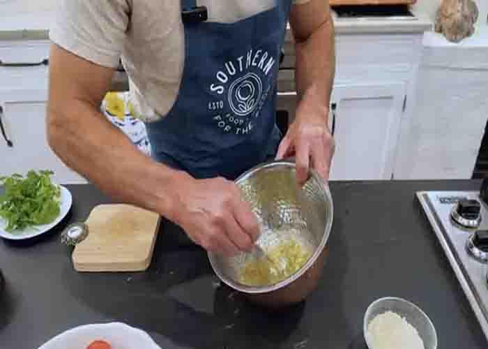 Mixing the topping for the roasted lemon-pecan tomatoes
