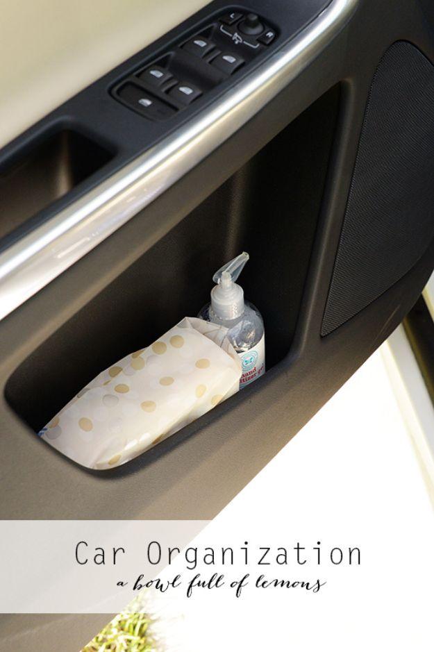 Car organization idea, a gold spotted tissue pack and a bottle of hand sanitizer tucked into a car door pocket