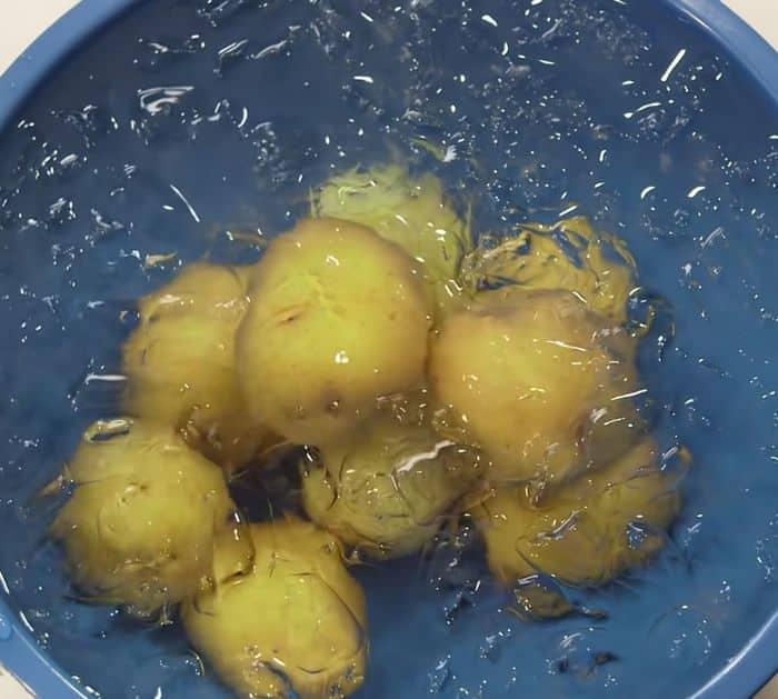 Boiled potatoes shocked in ice water so the skins peel themselves off, one of the best Thanksgiving hacks