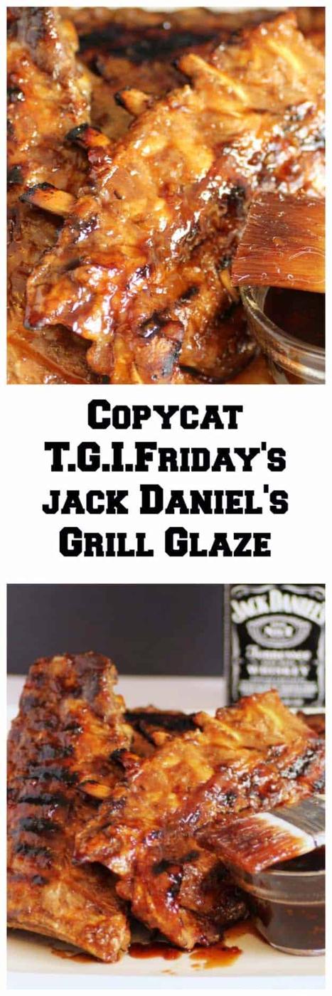 Jack Daniels grill glaze on lacquered barbecue ribs with a basting brush and a small dish of dark sauce