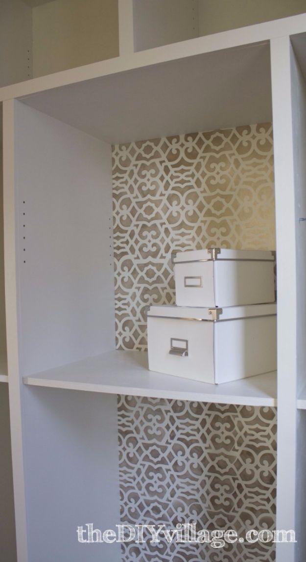 Kitchen pantry graphic with a white shelving unit whose back panel is stenciled in a gray tone on tone pattern