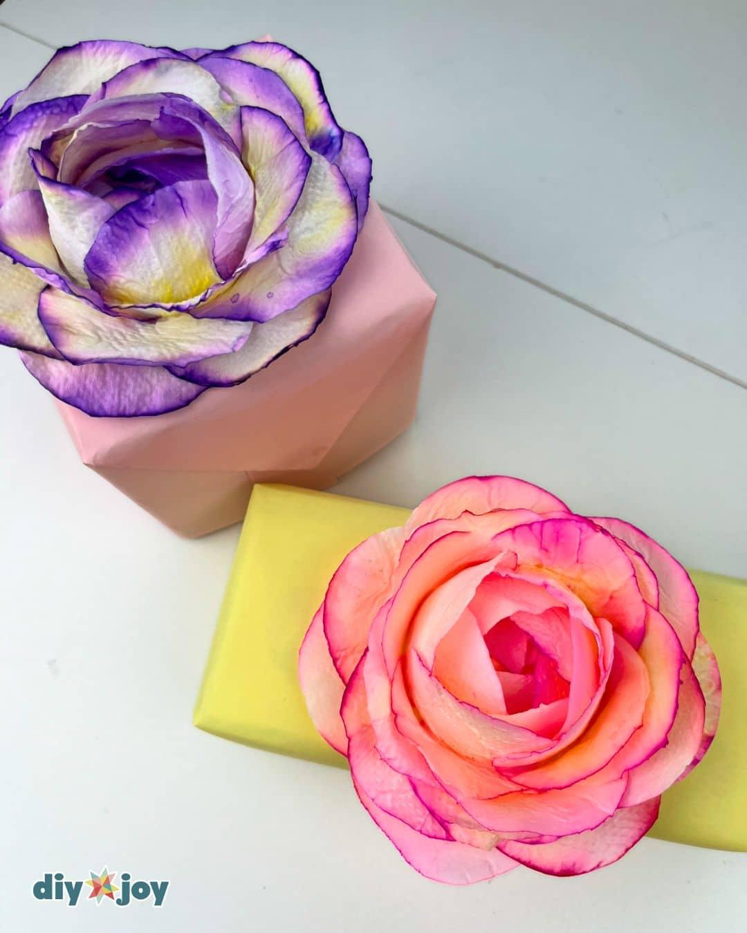 Easy craft ideas at home, a table set up with homemade toilet paper flowers in progress and finished