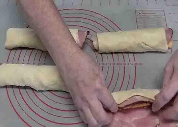 Rolling the ham and cheese crescent sticks
