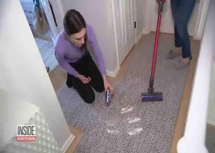 Sprinkling baking soda over the carpet to get rid off Winter stale