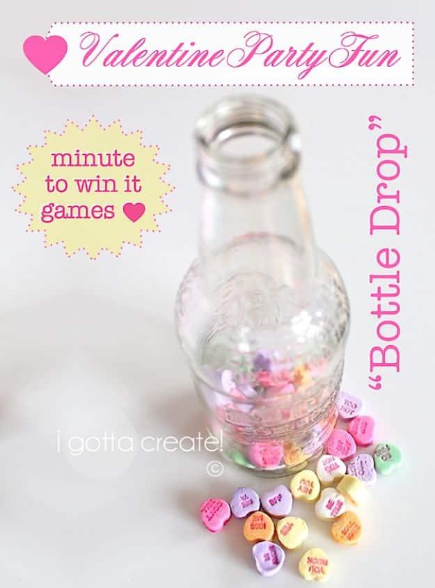 Bottle drop Valentine minute to win it game, dropping conversation hearts into a narrow necked glass bottle