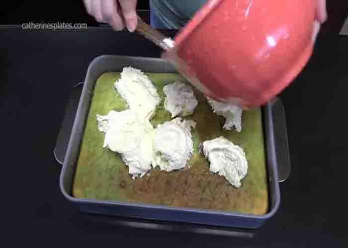 Spreading the cream layer over the lemon lime cake