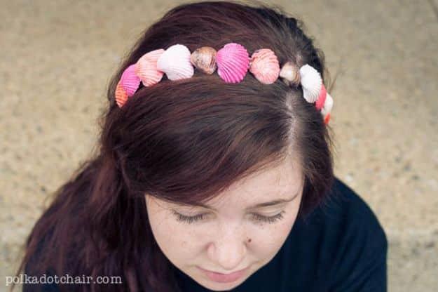Painted seashell accessories, a pink and white shell headband worn in dark hair, shells glued along the band