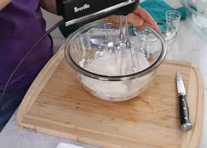 Making the cheesecake filling for the strawberries
