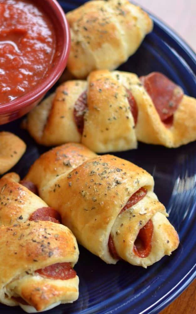 Mozzarella pepperoni croissants made with crescent rolls, served with a bowl of warm marinara for dipping