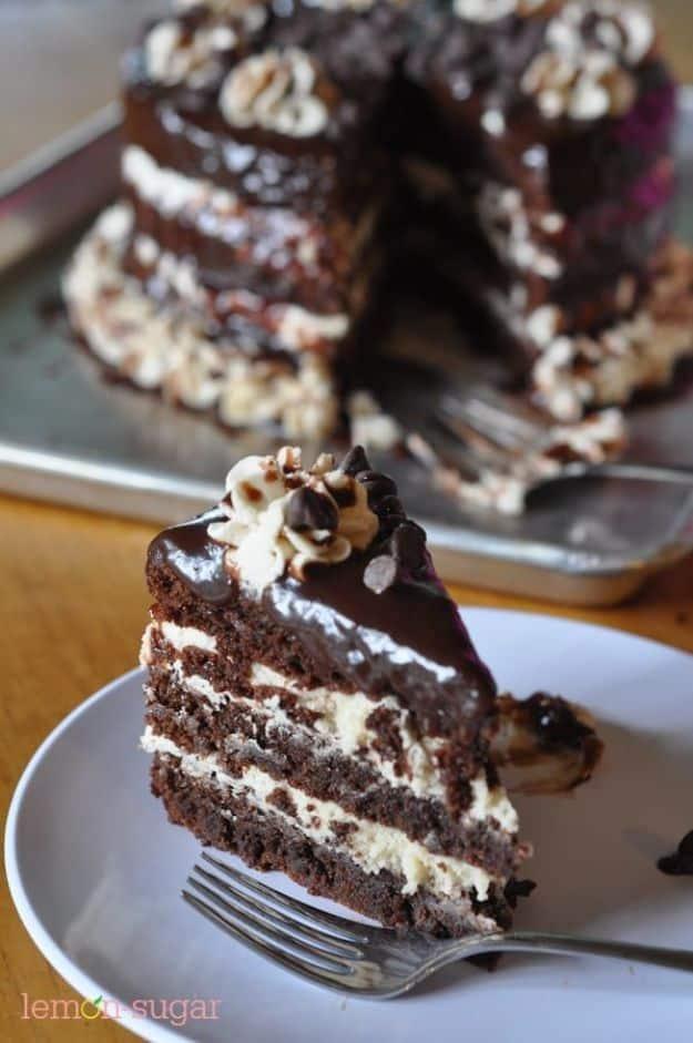 Brownie layer cake frosted with edible cookie dough and mini chocolate chips, an indulgent birthday bake