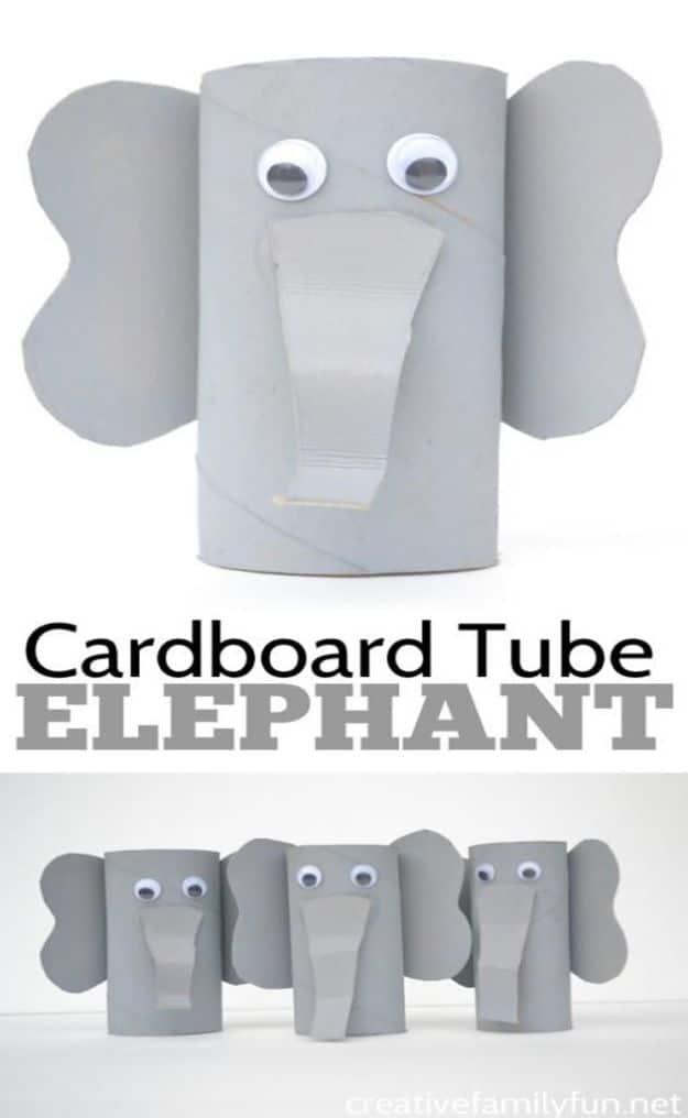 Gray cardboard tube elephant with cardboard ears, an accordion folded trunk and googly eyes, above a row of three
