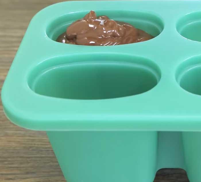 Pour Chocolate Into Popsicle Molds - Fudge Pops Recipe