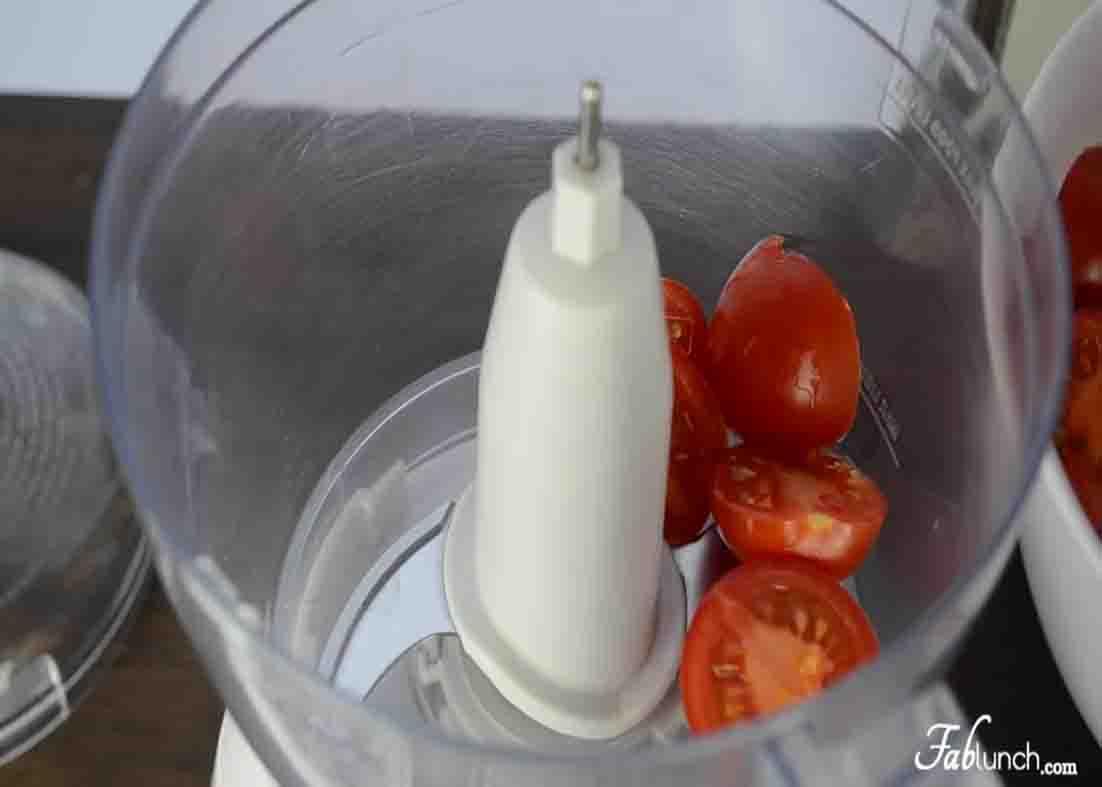 Processing the salsa ingredients on a food processor