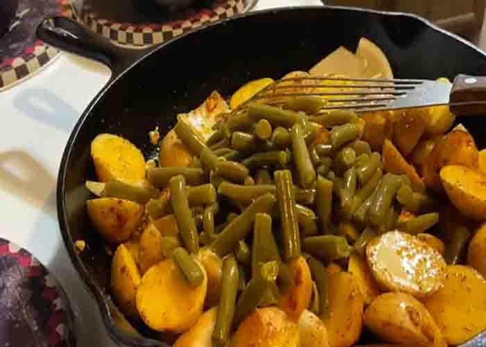 Cooking the green beans, sausages, and potatoes