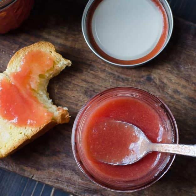Easy homemade guava jam in canning jars, deep pink, made with fresh pink guavas and a hint of vanilla bean