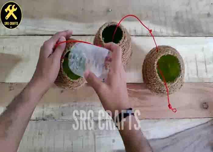 Inserting a plastic bottle on each plastic ball
