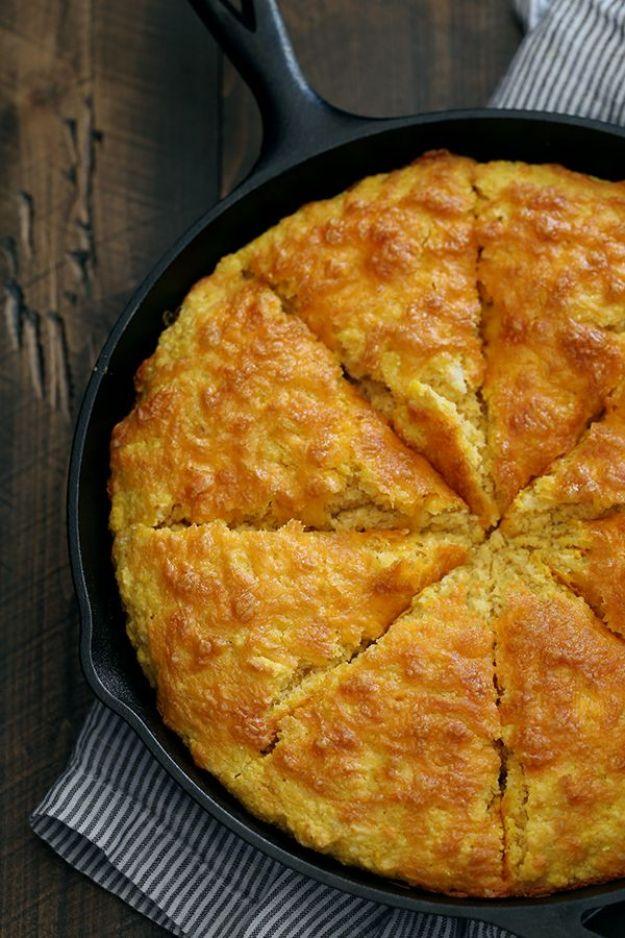 Pumpkin cream cheese cornbread baked deep golden in a cast iron skillet and cut into eight even wedges