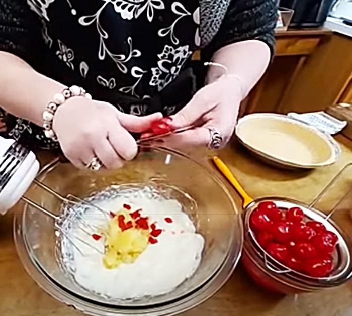 Dice Canned Pineapple And Maraschino Cherries For Millionaire Pie