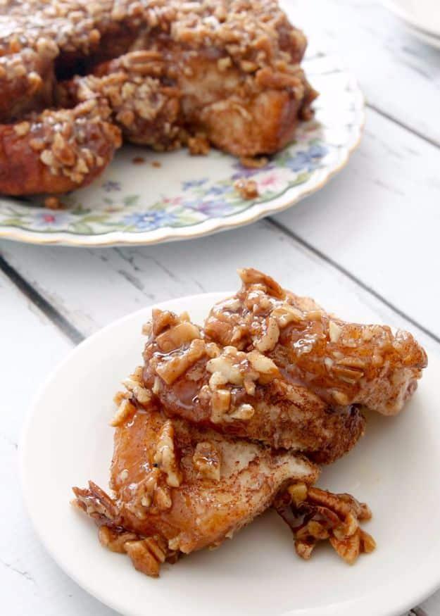 Caramel pecan sticky buns made from canned biscuits, flipped out of the pan with a glossy pecan top recipe worth making twice