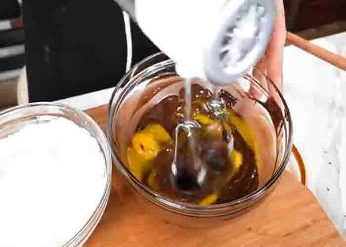 Mixing the melted chocolate and egg yolks