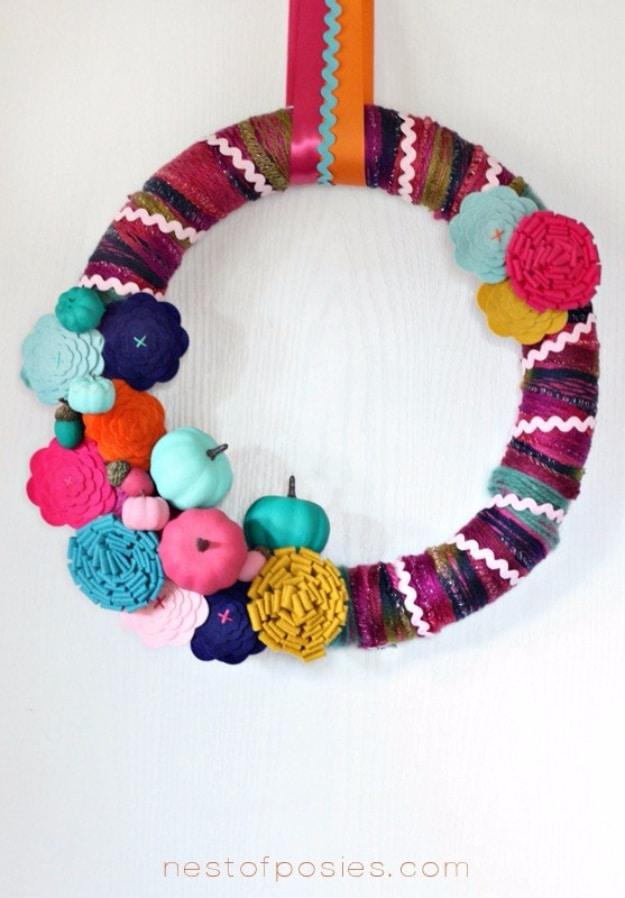 Autumn wreath of small pumpkins and posies with open negative space left between them, an airy fall wreath