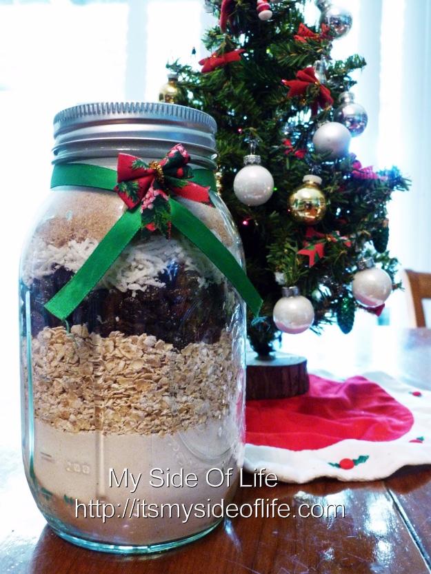 Wide mouth quart jar layered with oatmeal raisin cookie mix, coconut and two sugars for a holiday gift