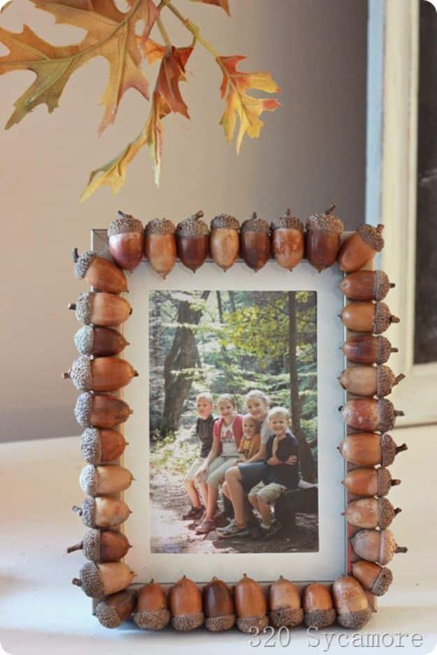 Picture frame edged with real acorns glued side by side, framing a family photo taken on an autumn hike