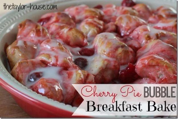 Cherry pie bubble breakfast bake with glazed canned biscuit pieces in bubbling cherry syrup, an easy canned biscuit recipe