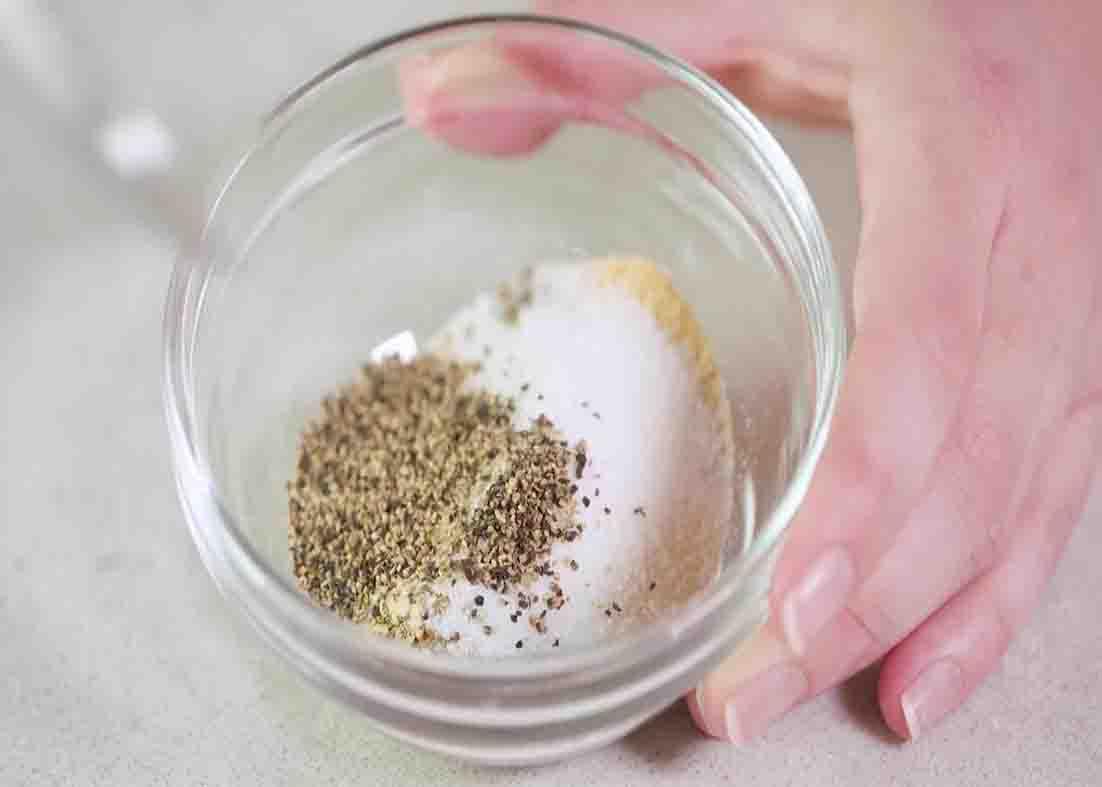 Combining all the spices for the chicken rub