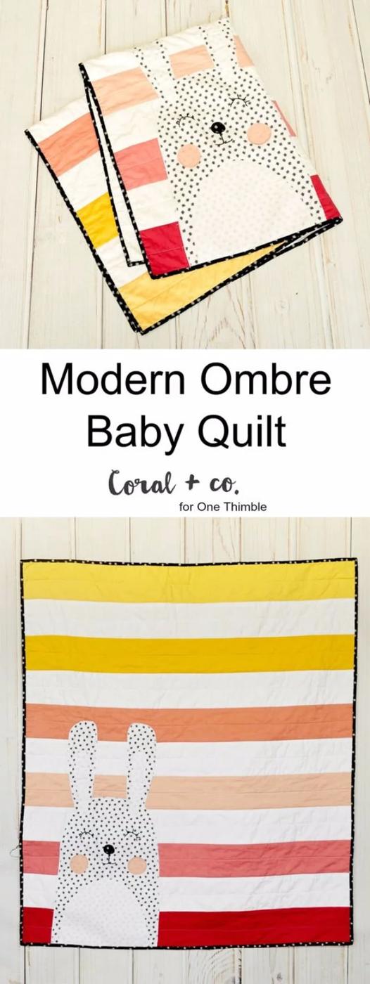 Ombre striped baby quilt in yellow, peach and red with a black star print bunny appliqued across the front