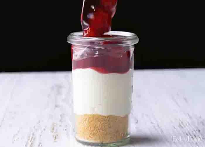 Assembling the cherry cream cheese dessert cups