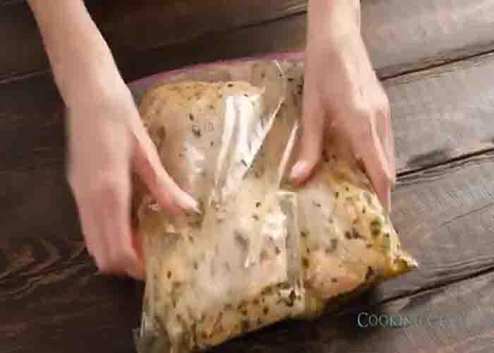 Marinating the chicken thighs for the one-pan chicken dinner recipe