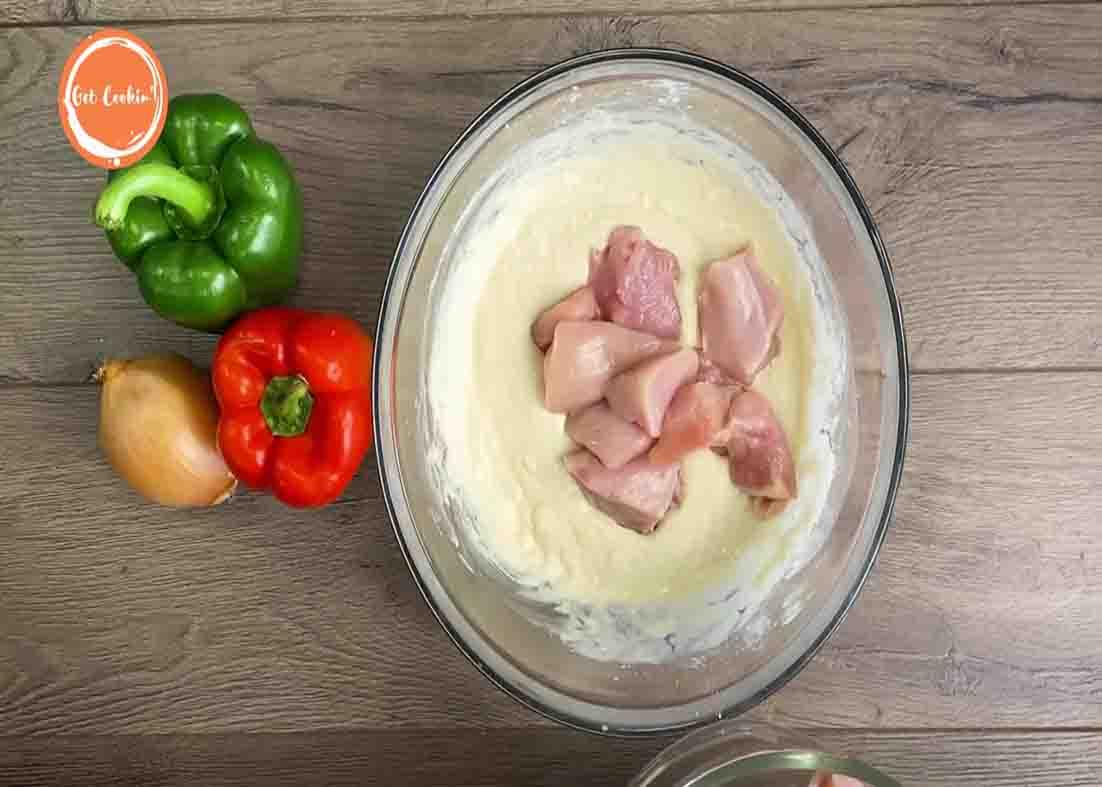 Dredging the chicken breasts of flour mixture