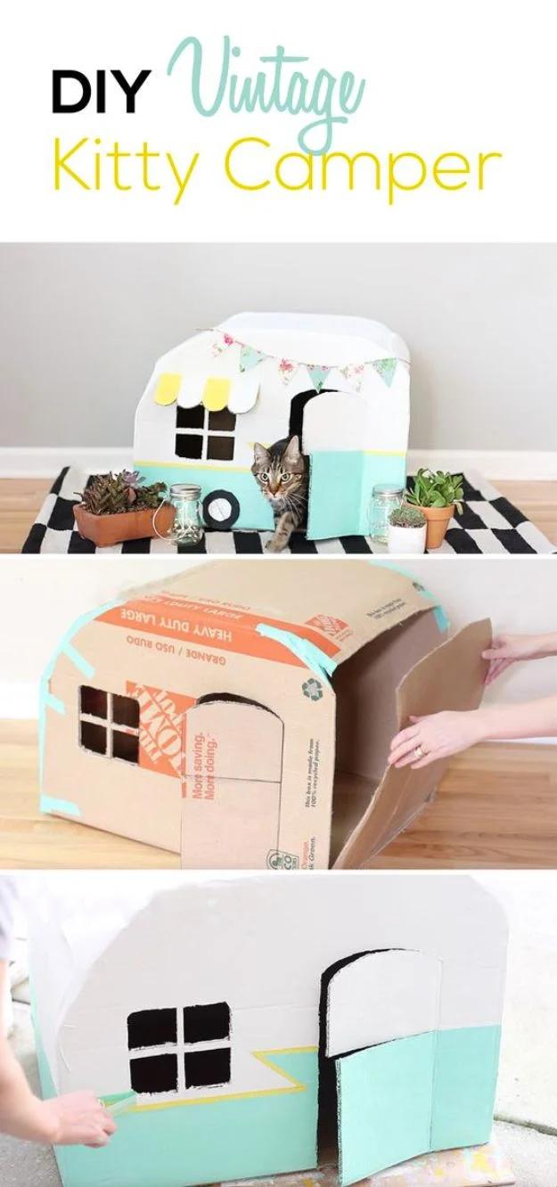Cardboard craft kitty camper collage showing a white and mint caravan with bunting and hands assembling a box
