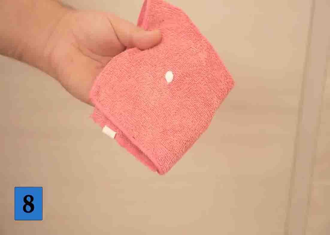 Wiping the wax crayons off of your wall using toothpaste