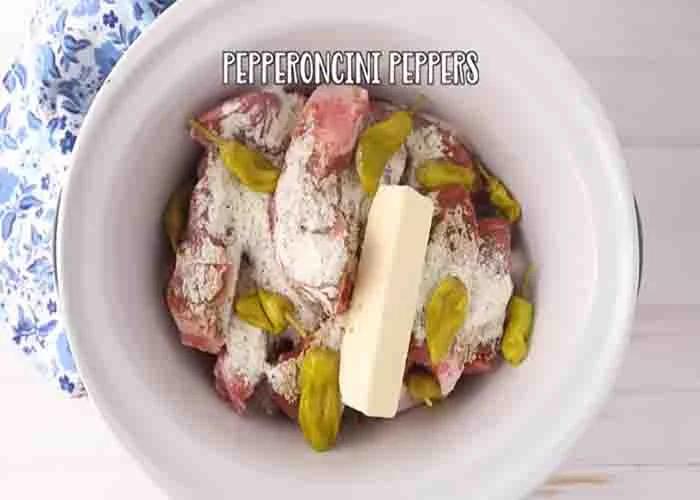 Adding the Mississippi country style ribs ingredients to the crockpot