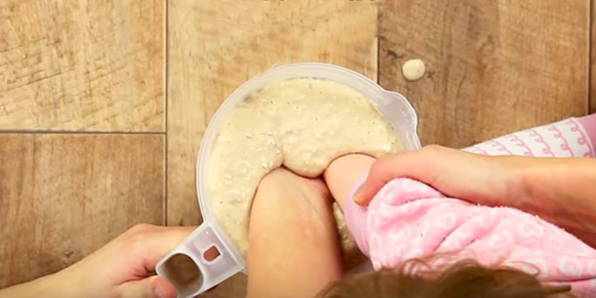 Mother And Daughter Put Their Hands In A Solution To Make This Really Cool Keepsake