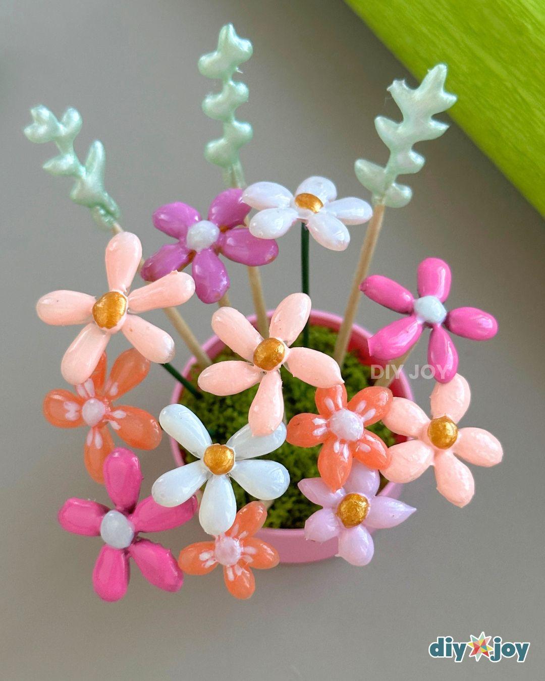 Easy Hot Glue Flowers — add the flowers