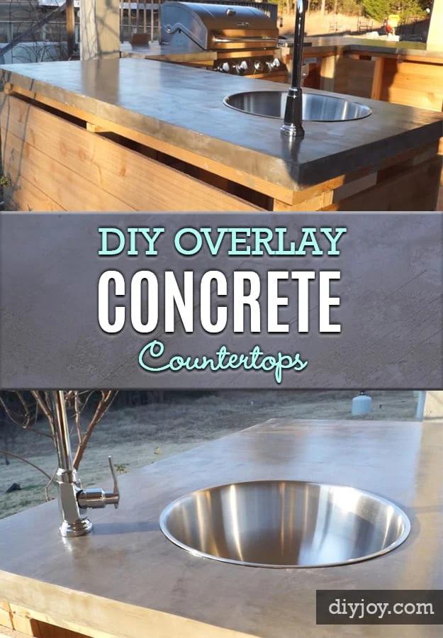 DIY concrete countertops, a smooth gray overlay counter on a wood sided island with a round stainless bar sink and faucet