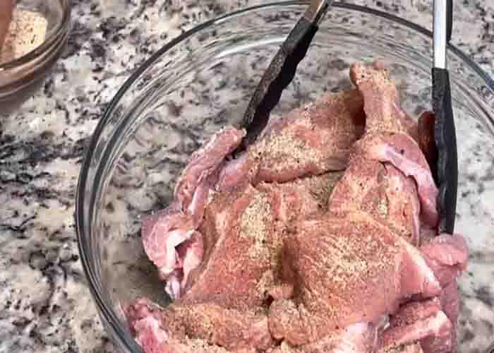 Coating the ribs with the seasoning mixture