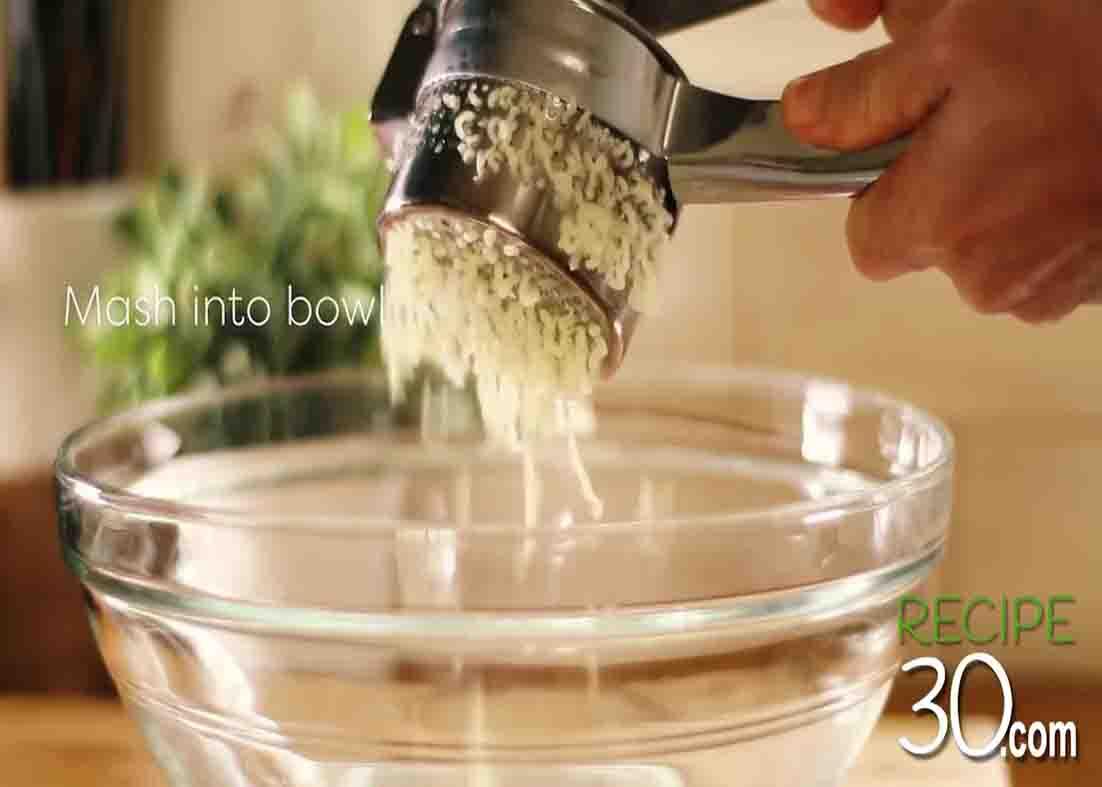 Mashing the potatoes for the potato swirls recipe