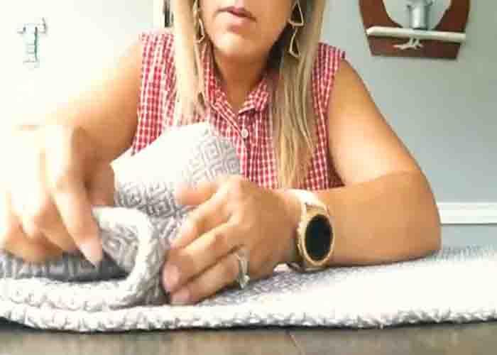Gluing the two area rugs from Dollar Tree to make the DIY pillow
