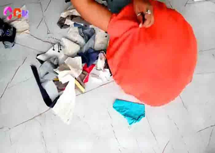 Filling the puff pillow with fabric scraps from old clothes